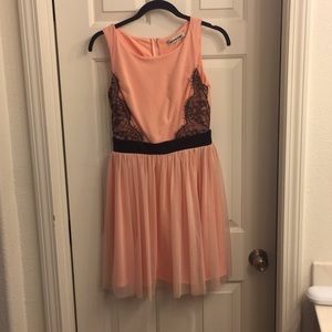 Peach dress with black lace detail